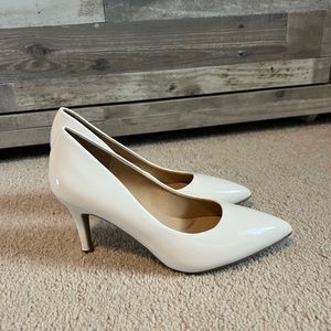White pointed heels